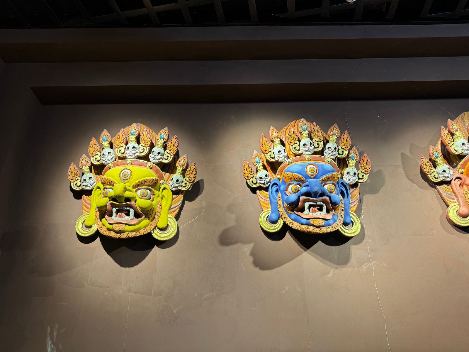 Yellow and blue hand-painted medicine-clay masks